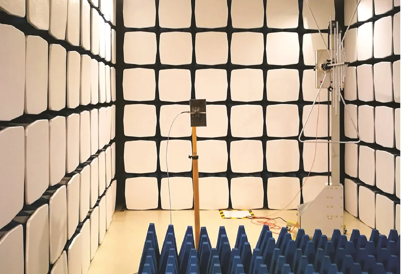 An electromagnetic compatibility chamber with absorber-lined walls