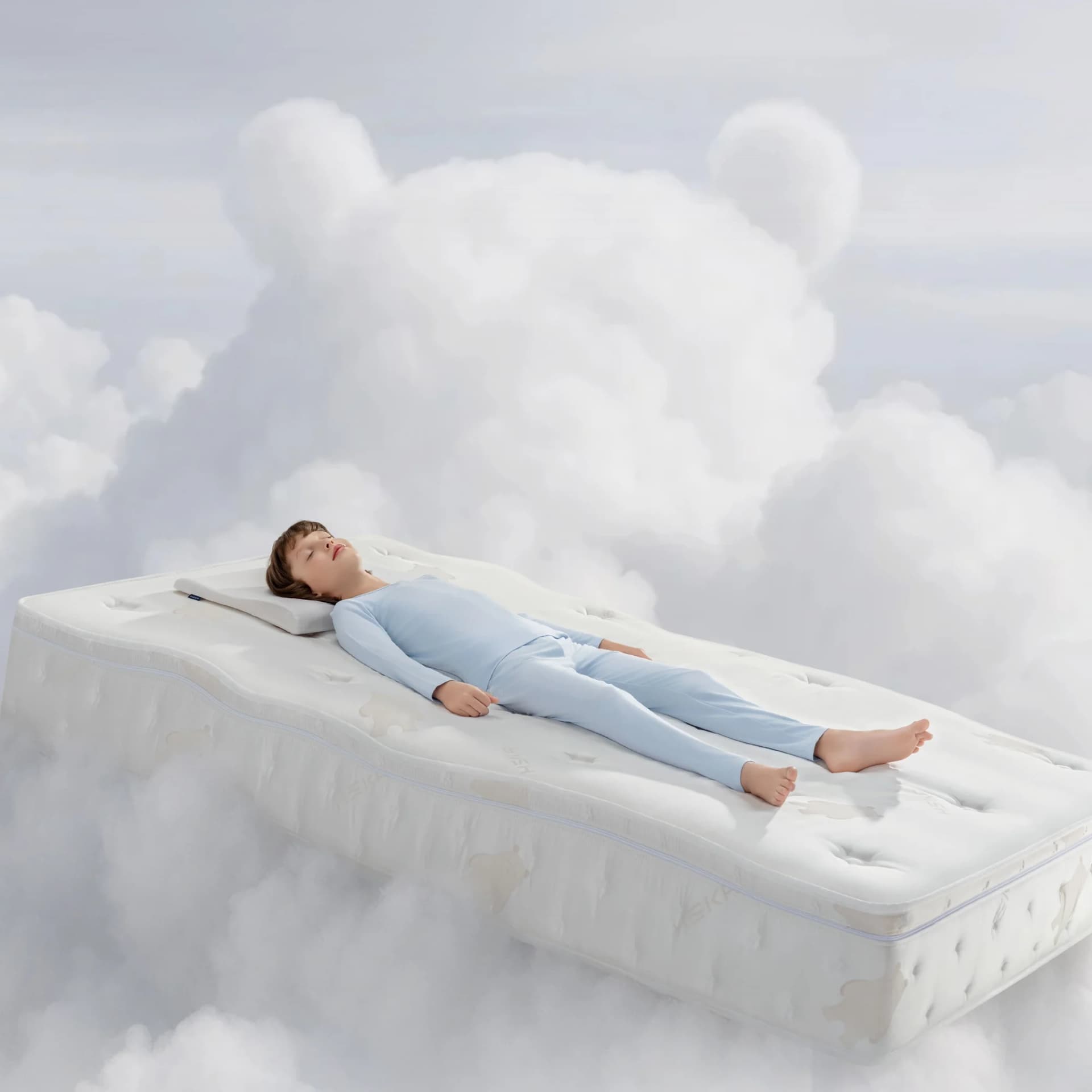 A child asleep on the HEKA AI Mattress CG Series among the clouds